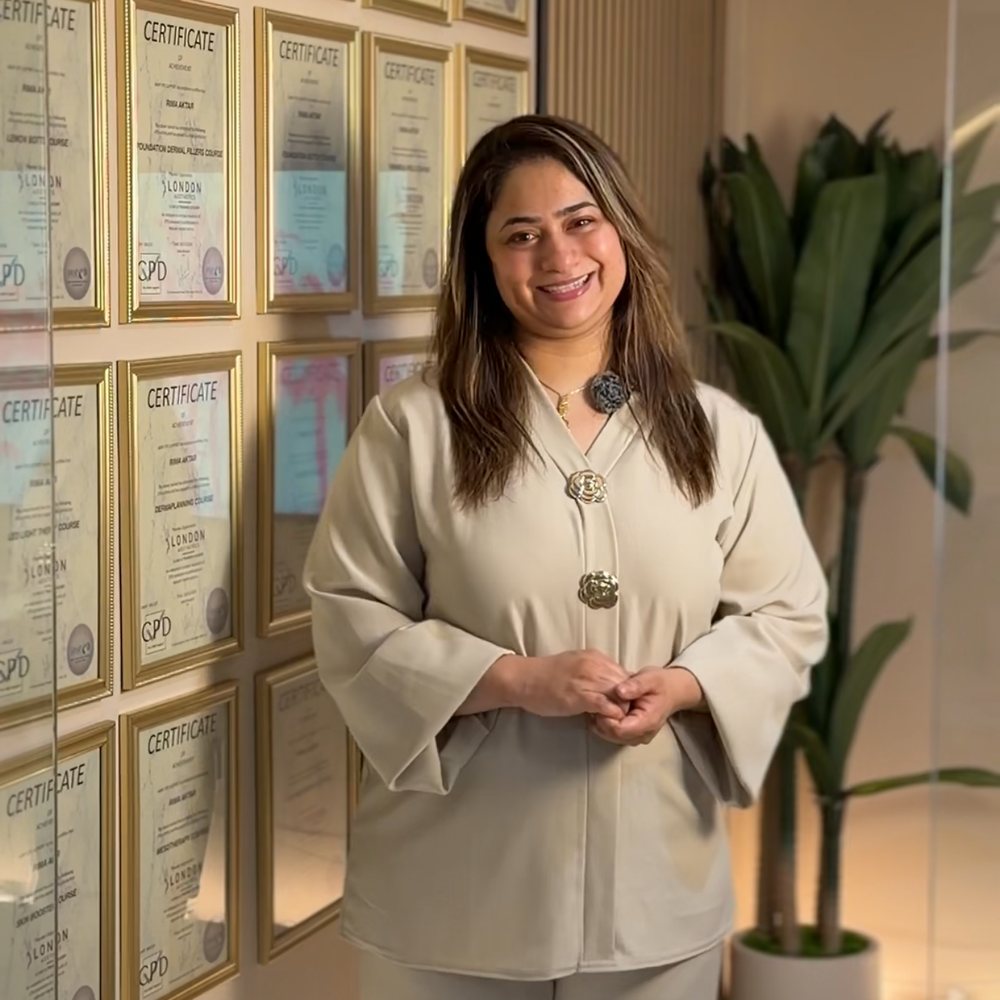 Rima Alam beside her certificates